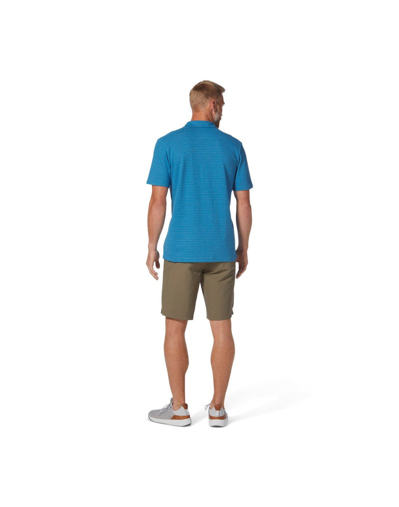 Man wearing Royal Robbins Men's Vacationer Polo in Tahoe Blue Str, back view.