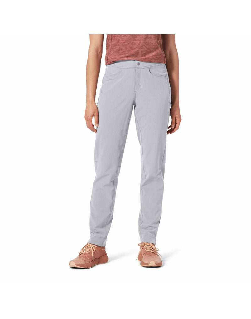 Front view of a woman's torso wearing Royal Robbins Women's Alpine Mountain Pro Pant in light pelican colour,  pink top and pink runners, front view