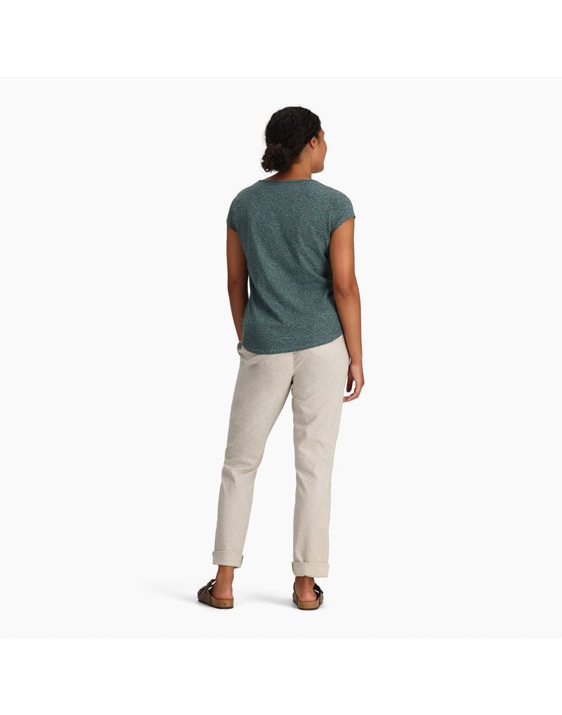Woman wearing Royal Robbins Women's Featherweight Slub Tee in sea pine with khaki pants and sandals, back view