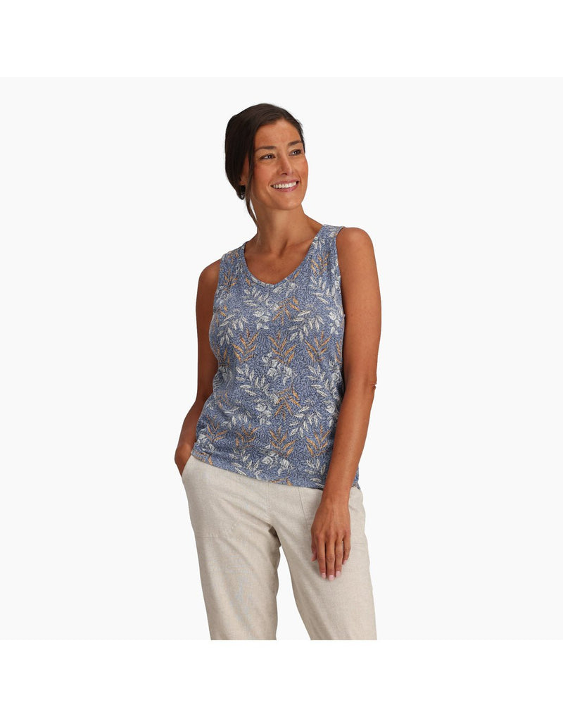 Top half of woman wearing Royal Robbins Women's Featherweight Tank in chicory blue usla print, and khaki pants, front view with one hand in pocket