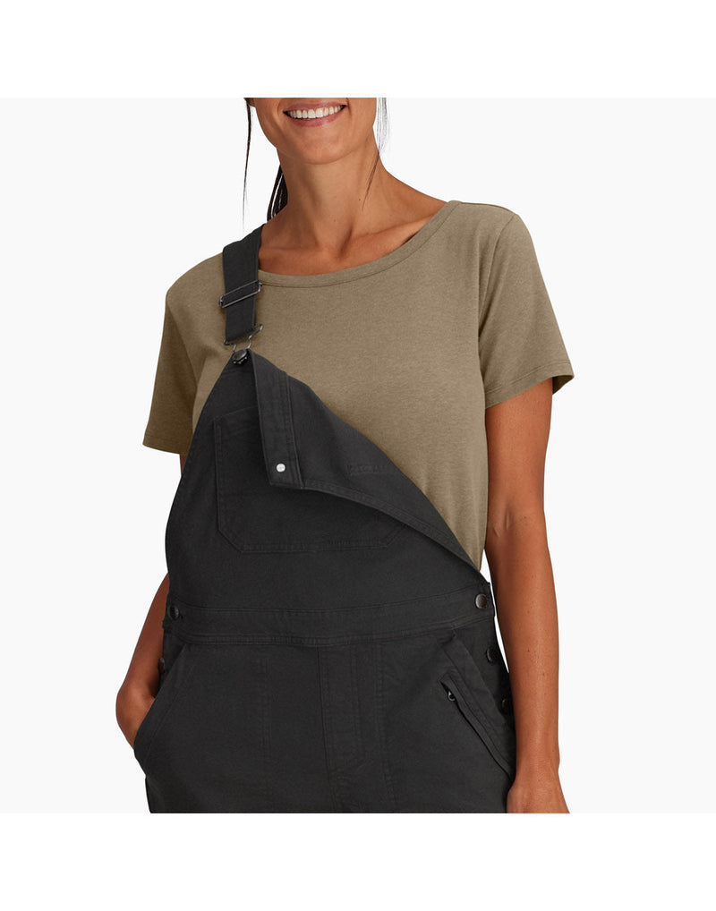 Top half of woman wearing Royal Robbins Women's Half Dome Overall in charcoal grey over a khaki t-shirt with one front button undone