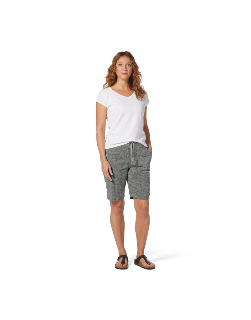 Woman wearing white t-shirt and black sandals with Royal Robbins Women's Hempline Tie Bermuda in asphalt, front view