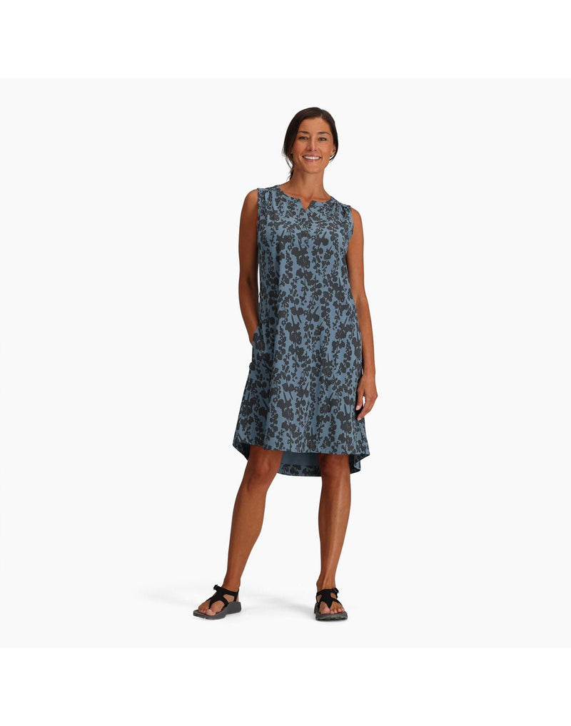 Woman wearing Royal Robbins Women's Spotless Traveller Tank Dress in sea alamere print, grey on blue floral, front view with belt tie undone