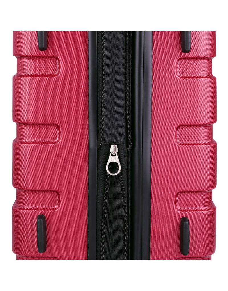 Close up of expandable zipper on red luggage