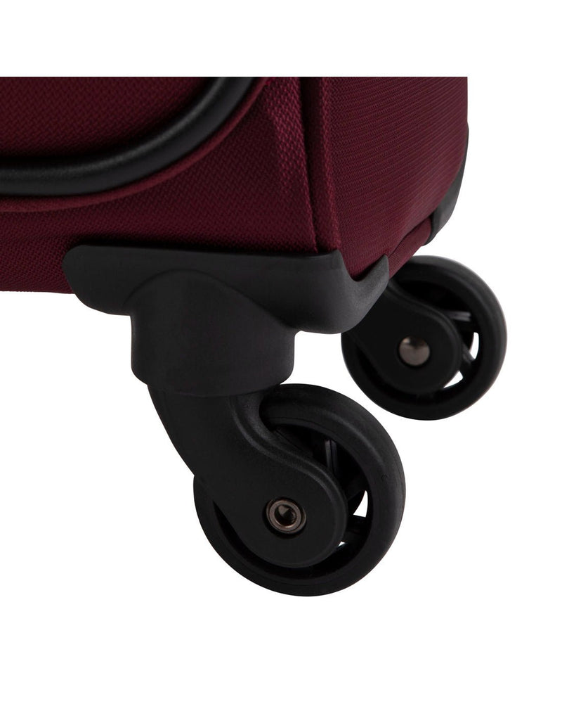Close up of black spinner wheels on Swiss Gear Luxury 24" Expandable Spinner in burgundy