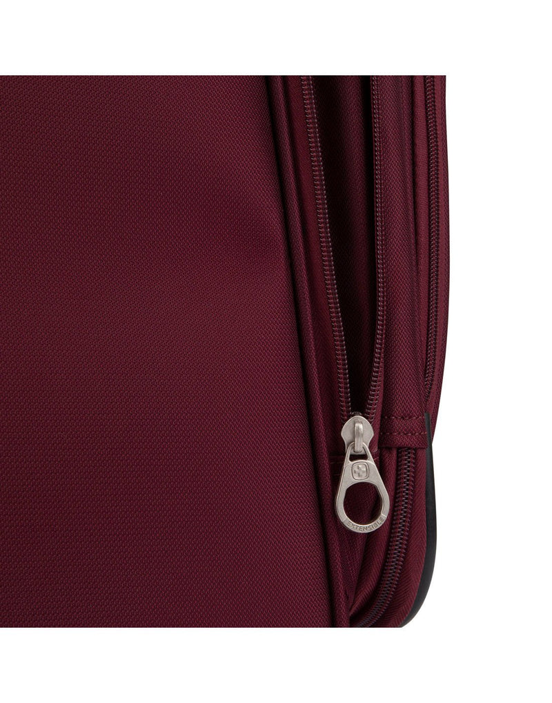 Close up of expandable zipper on Swiss Gear Luxury 24" Expandable Spinner in burgundy