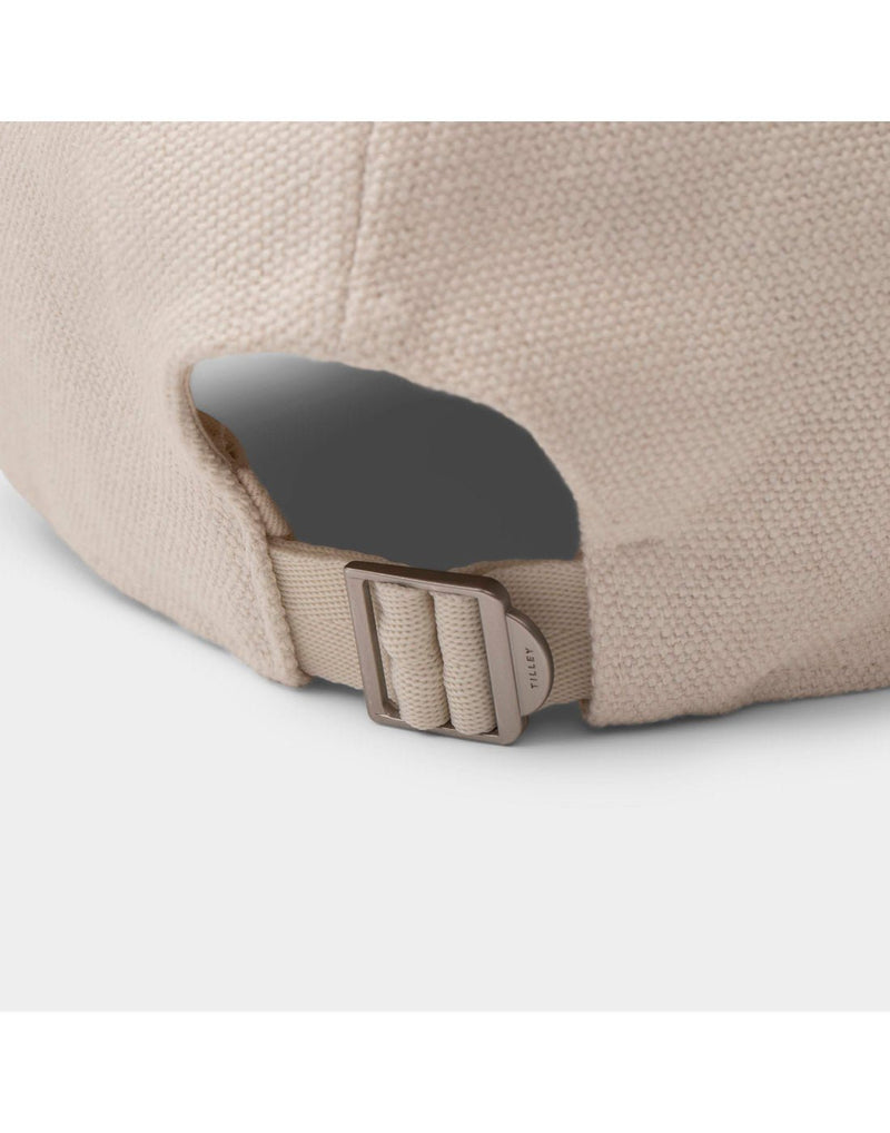 Close up of back of cap with dark metal slide size adjuster