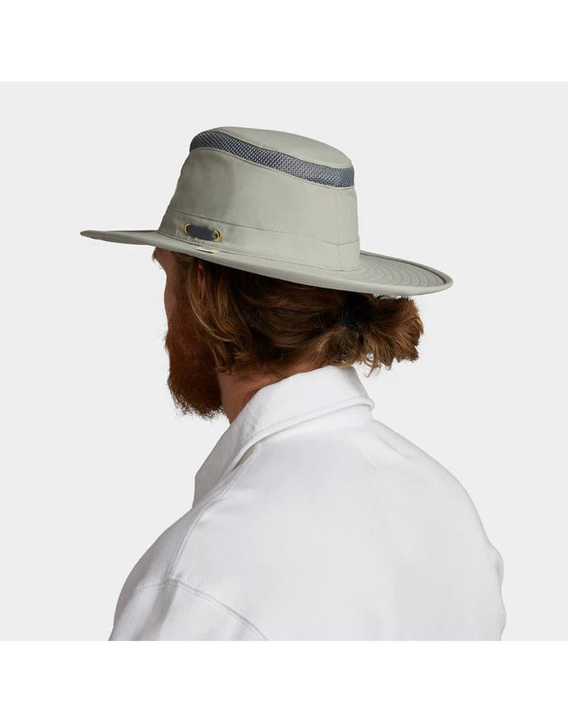 Man wearing white shirt with Tilley LTM6 AIRFLO® Hat in rockface, grey colour, back angled view