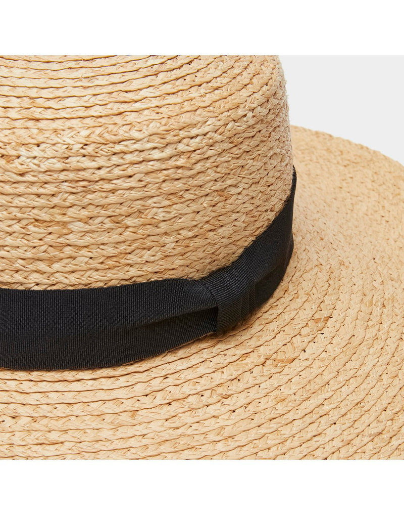 Close up of thick black fabric band around base of crown on the Tilley Raffia Wide Brimmed Hat
