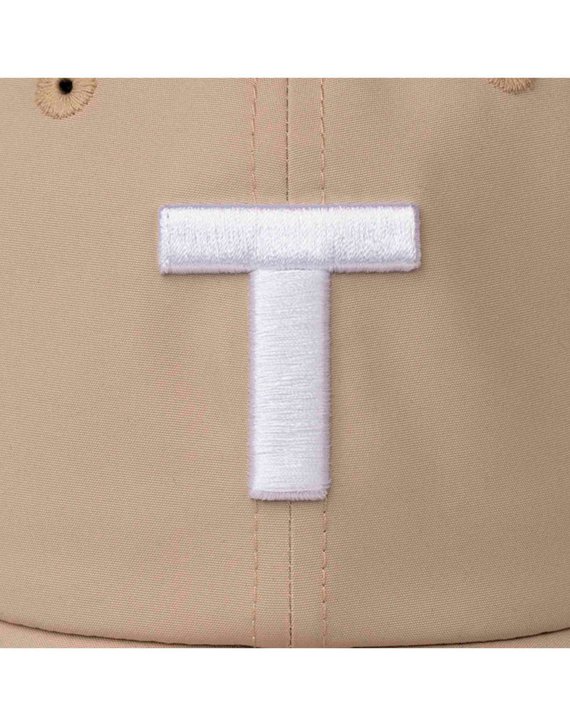 Close up of large white stitched T on light tan Tilley T Golf Cap