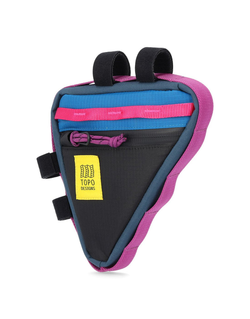 Front angled view of Topo Designs Bike Frame Bag in black and blue with pink daisy chain strip along top of triangular shaped bag, purple zipper pull, yellow rectangular logo patch, purple daisy chain webbing surrounding entire bag sides, and four black Velcro loops for attachment to bike