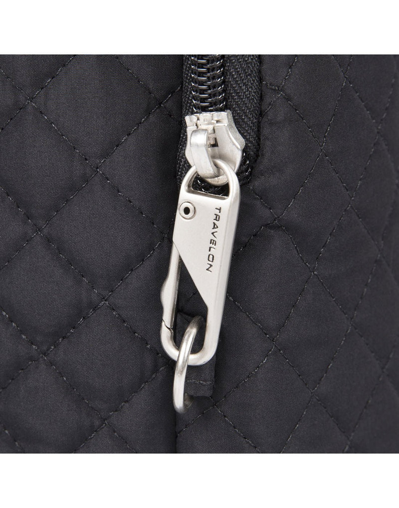 Travelon Boho Anti-Theft Insulated Water Bottle Tote in Black, close-up view of anti-theft zipper tab.
