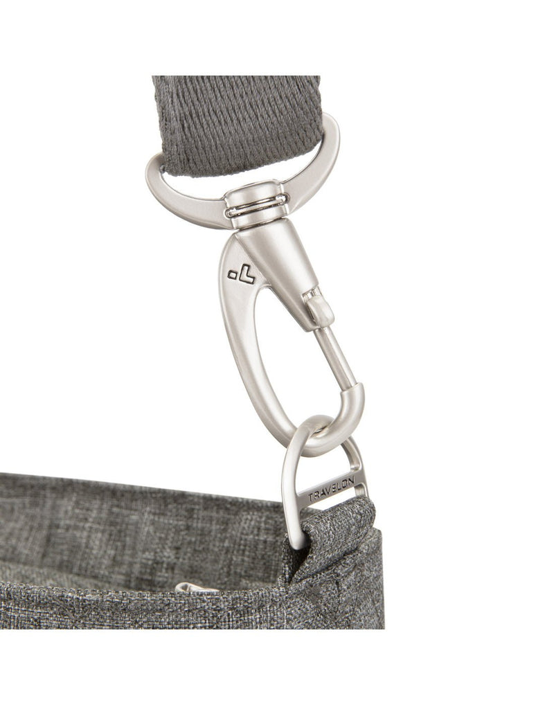 Close-up of the anti-theft shoulder strap clasp on the Travelon Boho Anti-Theft Tote in Grey Heather.