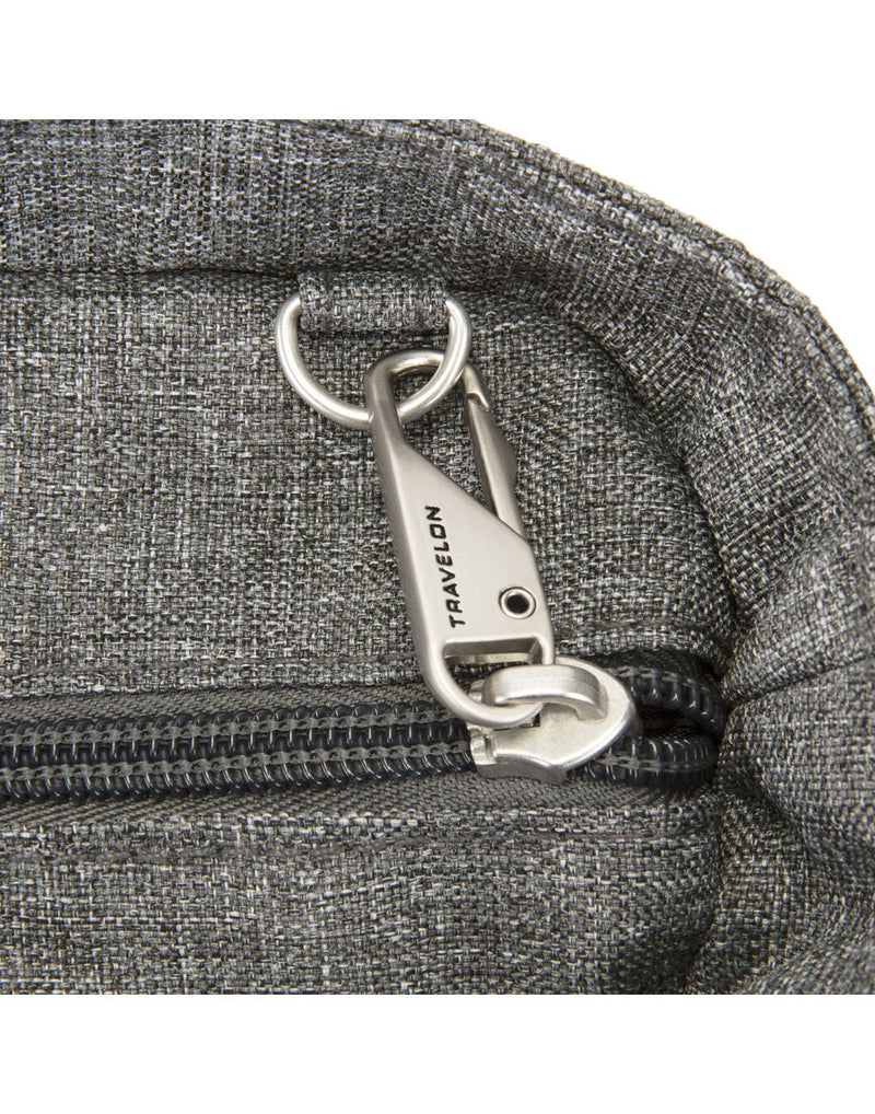 Close-up  of anti-theft zipper tab on the Travelon Boho Anti-Theft Tote in Grey Heather.